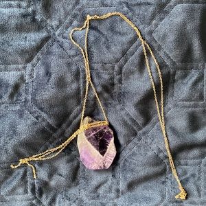 Amethyst gemstone on gold chain